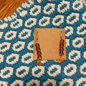 Orange clear earrings with orange butterfly charm